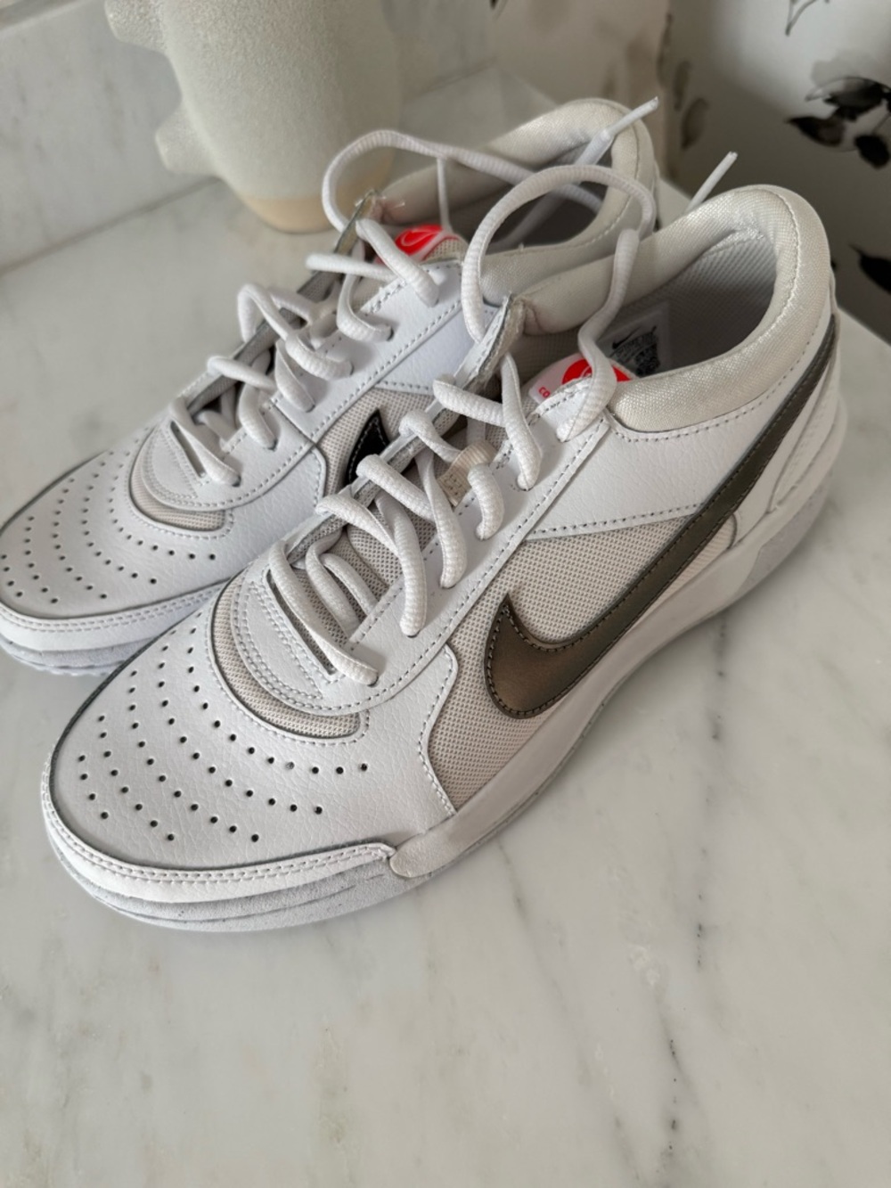 Nike women’s White tennis/pickleball Sneakers with Metallic Bronze Swoosh